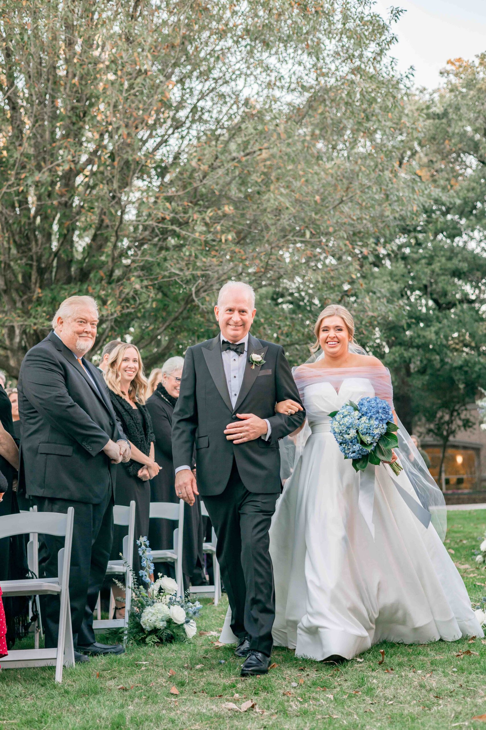 gallery of images of dad walking daughter down the aisle, while moms are emotional and guests look on.